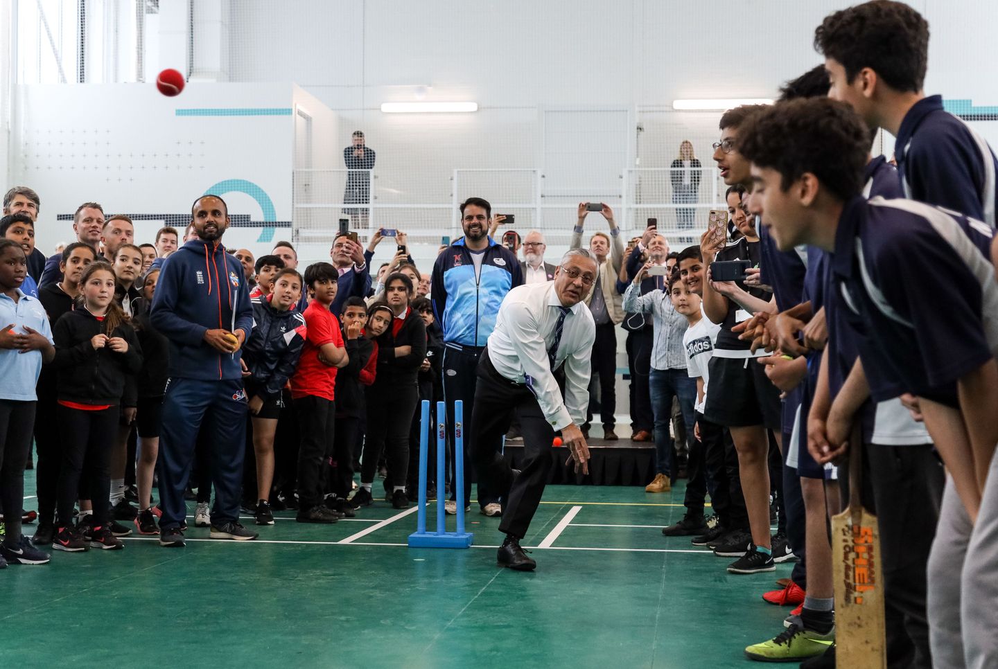 Lord Patel of Bradford bowls at the new Urban Cricket Centre in Leyton
