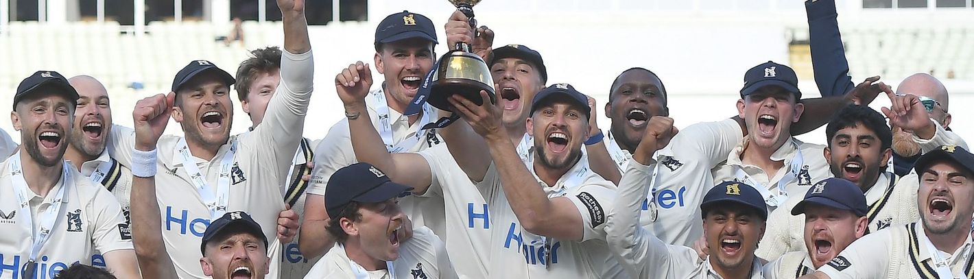 Warwickshire lift the 2026 Rothesay County Championship trophy