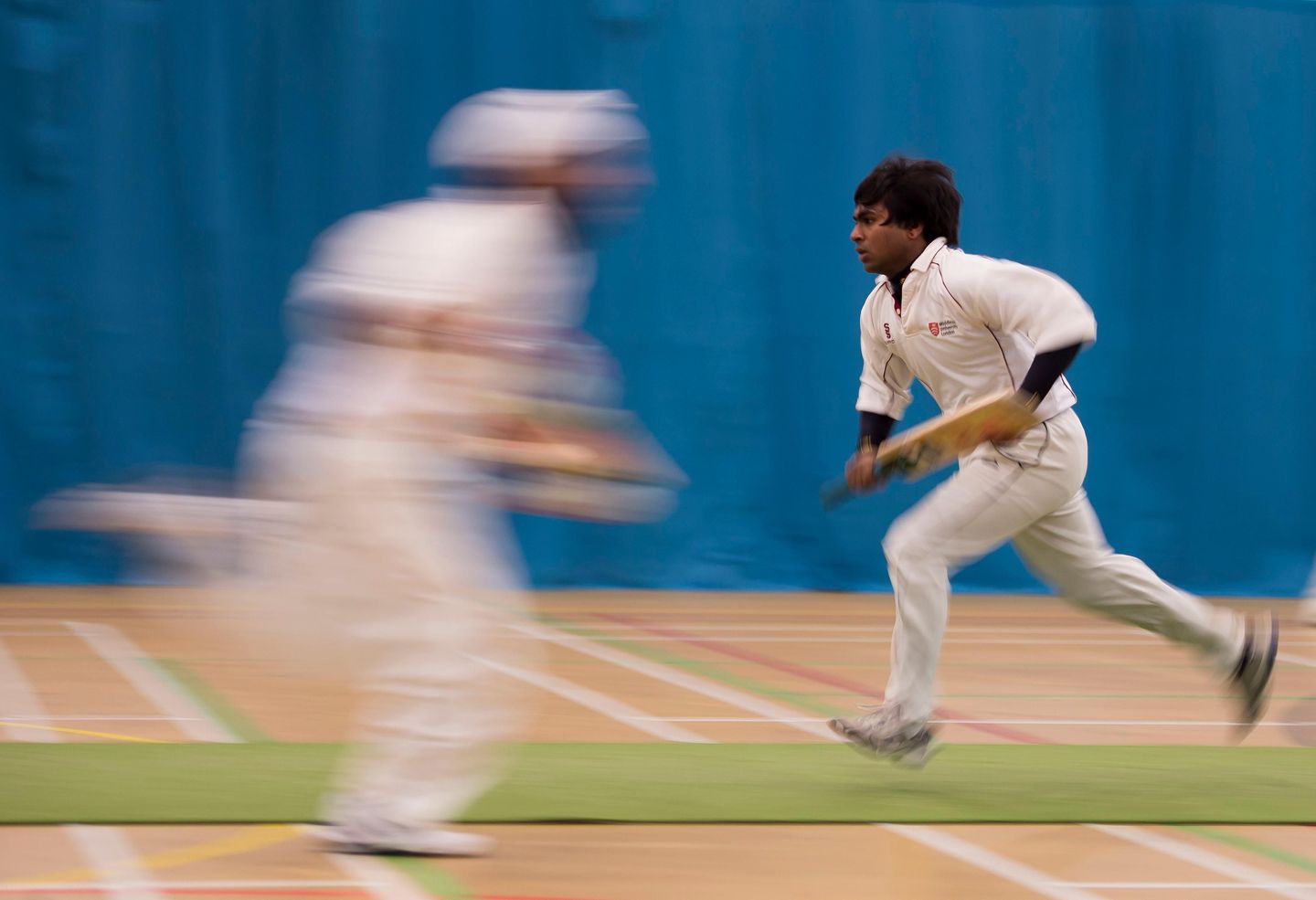 Indoor players run between the wickets