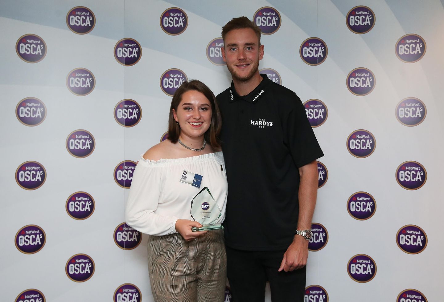 England bowler Stuart Broad with Young Volunteer of the Year Megan Jones